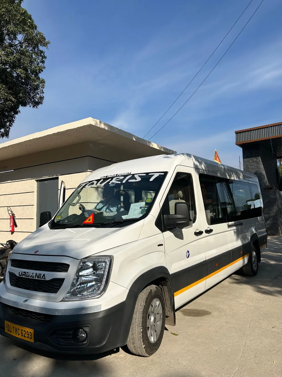 New India Travels white Urbania traveller vehicle
